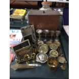 A QUANTITY OF BRASSWARE TO INCLUDE, A COAL BOX, PHOTO FRAMES, CANDLESTICKS, TRIVETS, ETC