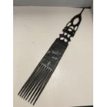 A CARVED TRIBAL COMB LENGTH 67CM