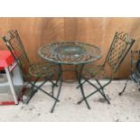 A VINTAGE CAST ALLOY BISTRO SET COMPRISING OF ROUND TABLE AND TWO CHAIRS WITH FLORAL DESIGN
