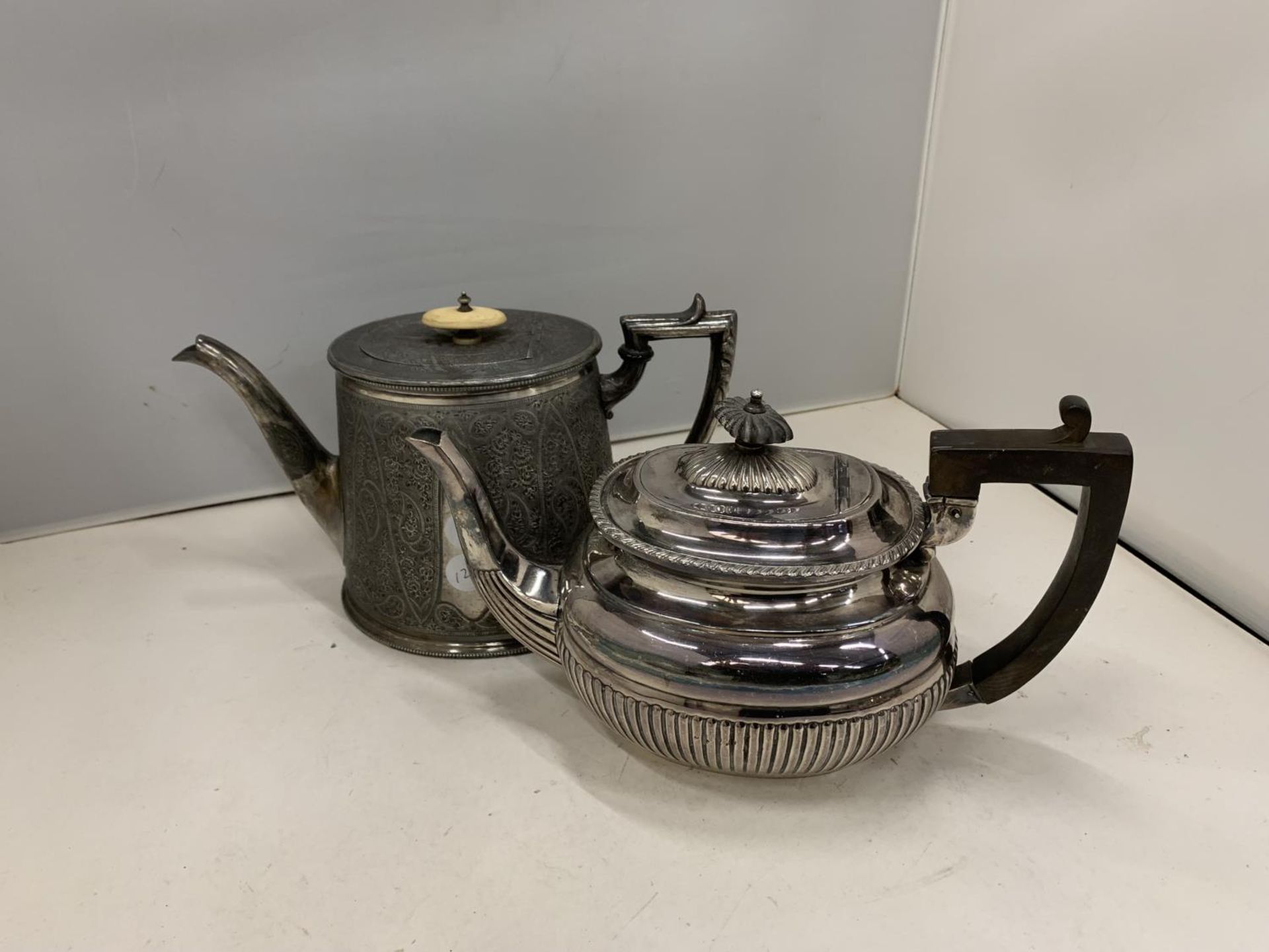 TWO SILVER PLATED TEAPOTS