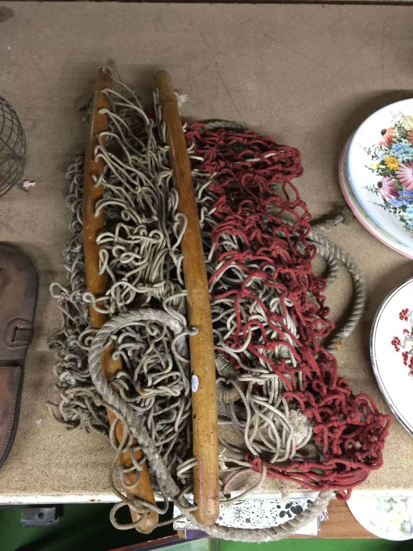 A ROPE HAMMOCK WITH WOODEN HANDLES, A LEATHER BAG AND A METAL POT - Image 2 of 4