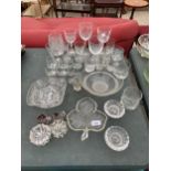 A LARGE QUANTITY OF GLASS WARE TO INCLUDE WINE GLASSES, SHERRY GLASSES AND CANDLE HOLDERS ETC