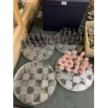 NINE ACRYLIC CHESS BOARDS TOGETHER WITH CHESS PIECES