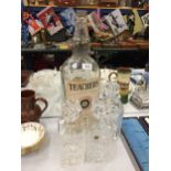 A LARGE TEACHERS SCOTCH WHISKY BOTTLE AND THREE DECANTERS