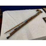 FOUR WOODEN WALKING STICKS IN VARIOUS DESIGNS