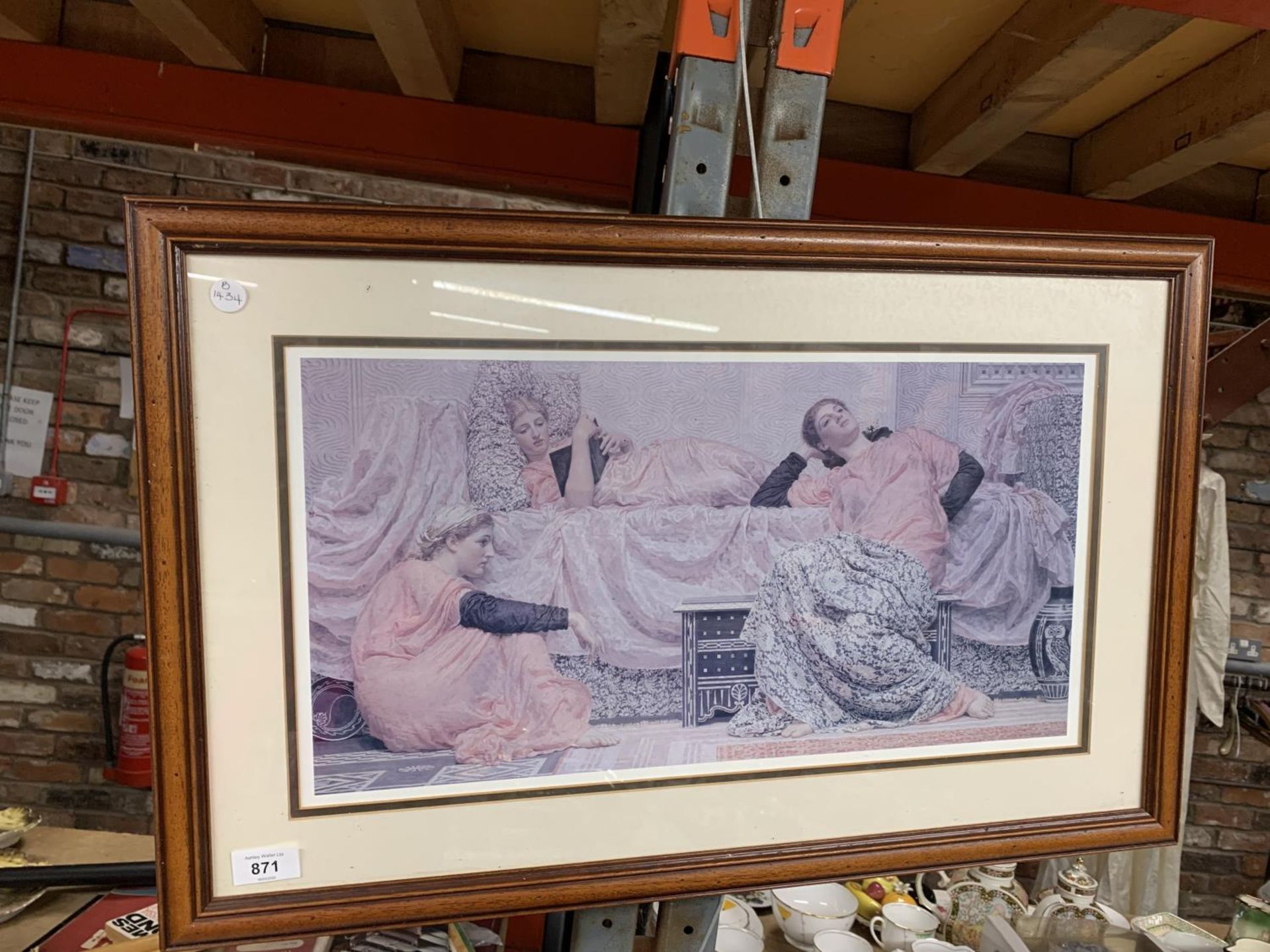 A FRAMED PRINT OF THREE YOUNG LADIES RELAXING