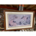 A FRAMED PRINT OF THREE YOUNG LADIES RELAXING
