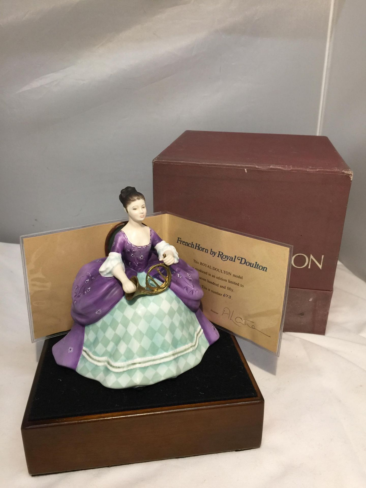 A ROYAL DOULTON FIGURINE, FRENCH HORN HN2795, MODELLED BY PEGGY DAVIES AS PART OF THE LADY MUSICIANS