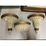 TWO CREAM AND GILT WALL MOUNTED DECORATIVE PLANT STANDS AND A WALL MOUNTED PLANTER