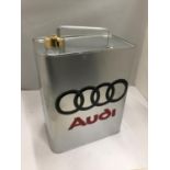 A SILVER COLOURED AUDI PETROL CAN WITH BRASS STOPPER