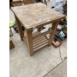 A WOODEN BUTCHERS BLOCK KITCHEN UNIT