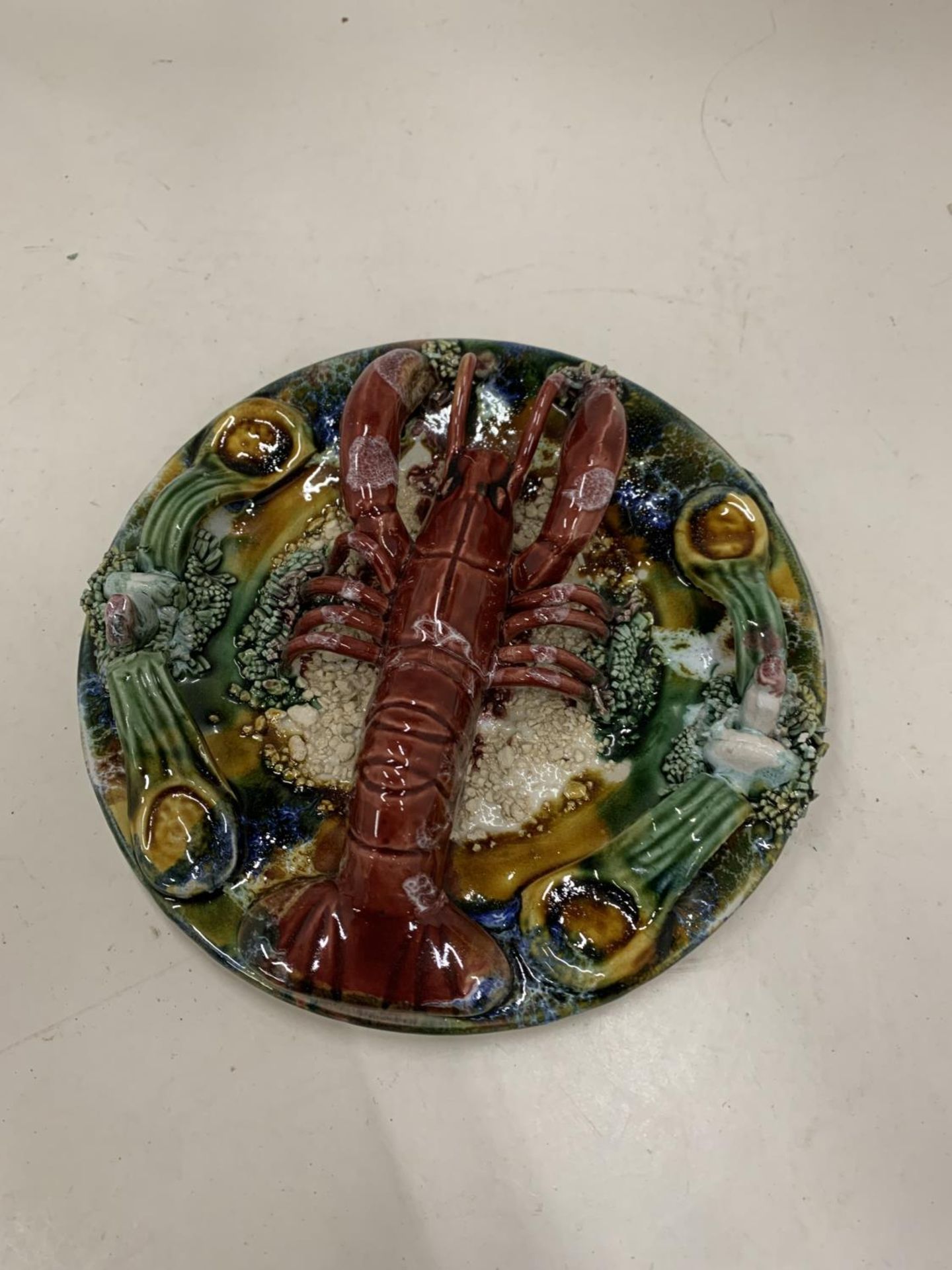 A CERAMIC LOBSTER WALL PLAQUE