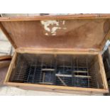 A WOODEN STORAGE CRATE WITH FOUR INDIVIDUAL BIRD CAGES