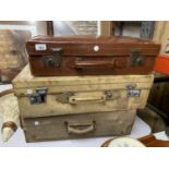 THREE VINTAGE SUITCASES TO INCLUDE TWO LEATHER AND A CANVAS