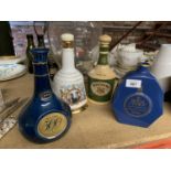 THREE SPODE DECANTERS AND A FOURTH WADE DECANTER