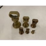 SIX BRASS WEIGHTS