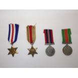 A COLLECTION OF FOUR WWII STARS AND MEDALS TO INLCUDE A FRANCE AND GERMANY STAR, AN AFRICA STAR, A