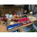 A MIXED LOT TO INCLUDE BOXED FLATWARE, BOOKENDS, DECANTERS AND GLASS ITEMS