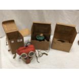 A WORLD WAR II CIVILIAN ISSUE CHILDS GAS MASK, IN ORIGINAL CARDBOARD BOX, ADULTS GAS MASK IN BOX AND