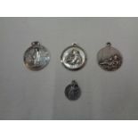 FOUR ASSORTED RELIGIOUS MEDALLIONS IN A PRESENTATION BOX