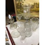 A COLLECTION OF GLASSWARE TO INCLUDE CANDLEHOLDERS, VASES, A LAMP, ETC
