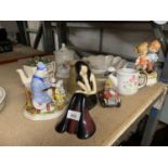A NUMBER OF CERAMIC FIGURES, A TEAPOT AND A LARGE DISH