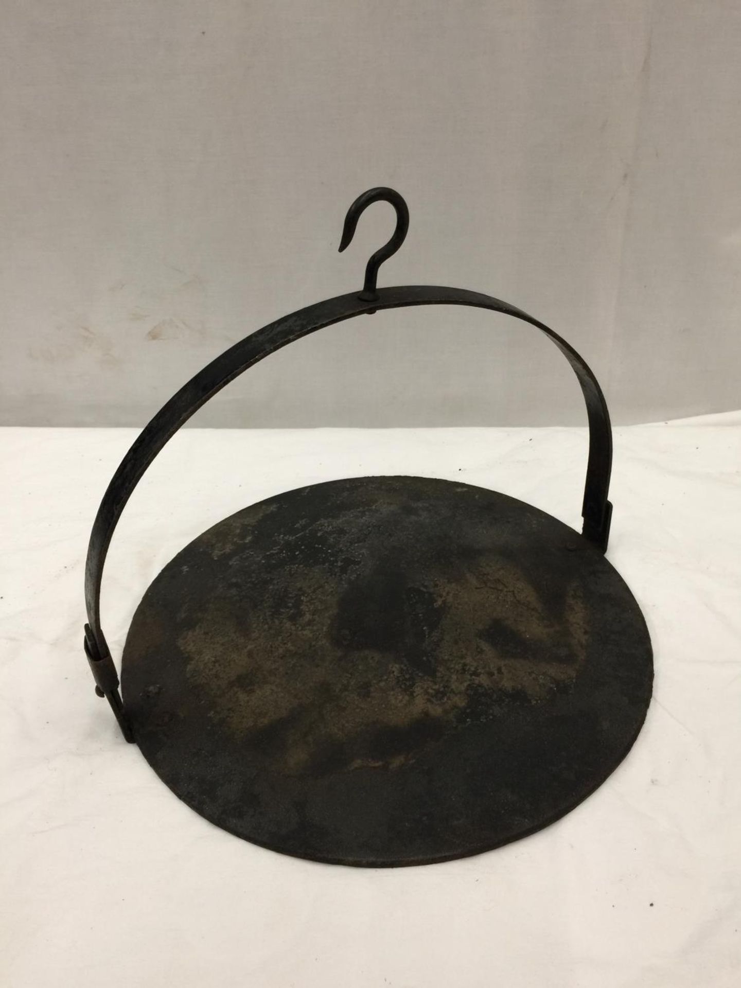 A VINTAGE SUSPENDED IRON GRILLING TRAY