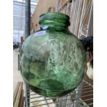 A GREEN GLASS CARBOY BEARING THE LABEL VIRESA