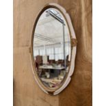 A DECORATIVE CREAM OVAL MIRROR