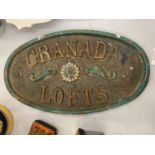 A CAST IRON WALL SIGN 'GRANADA LOFTS'