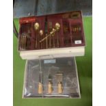 A BOXED YELLOW METAL 26 PIECE VINERS CUTLERY SET AND A SLATE CHEESE BOARD AND CUTTERS