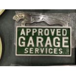 A CHROME JAGUAR APPROVED GARAGE SERVICES SIGN