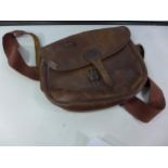 A LEATHER SHOOTING BAG AND STRAP