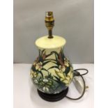A MOORCROFT TABLE LAMP WITH A WATER LILY/BULLRUSH DESIGN