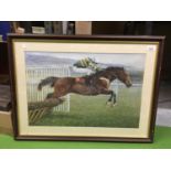 A LARGE FRAMED PRINT OF A RACEHORSE JUMPING A HURDLE 67CM X 57CM