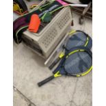 A PET CAGE, TWO TENNIS RACKETS, A HOCKEY STICK WITH ACCESSORIES AND A PICTURE SHELF