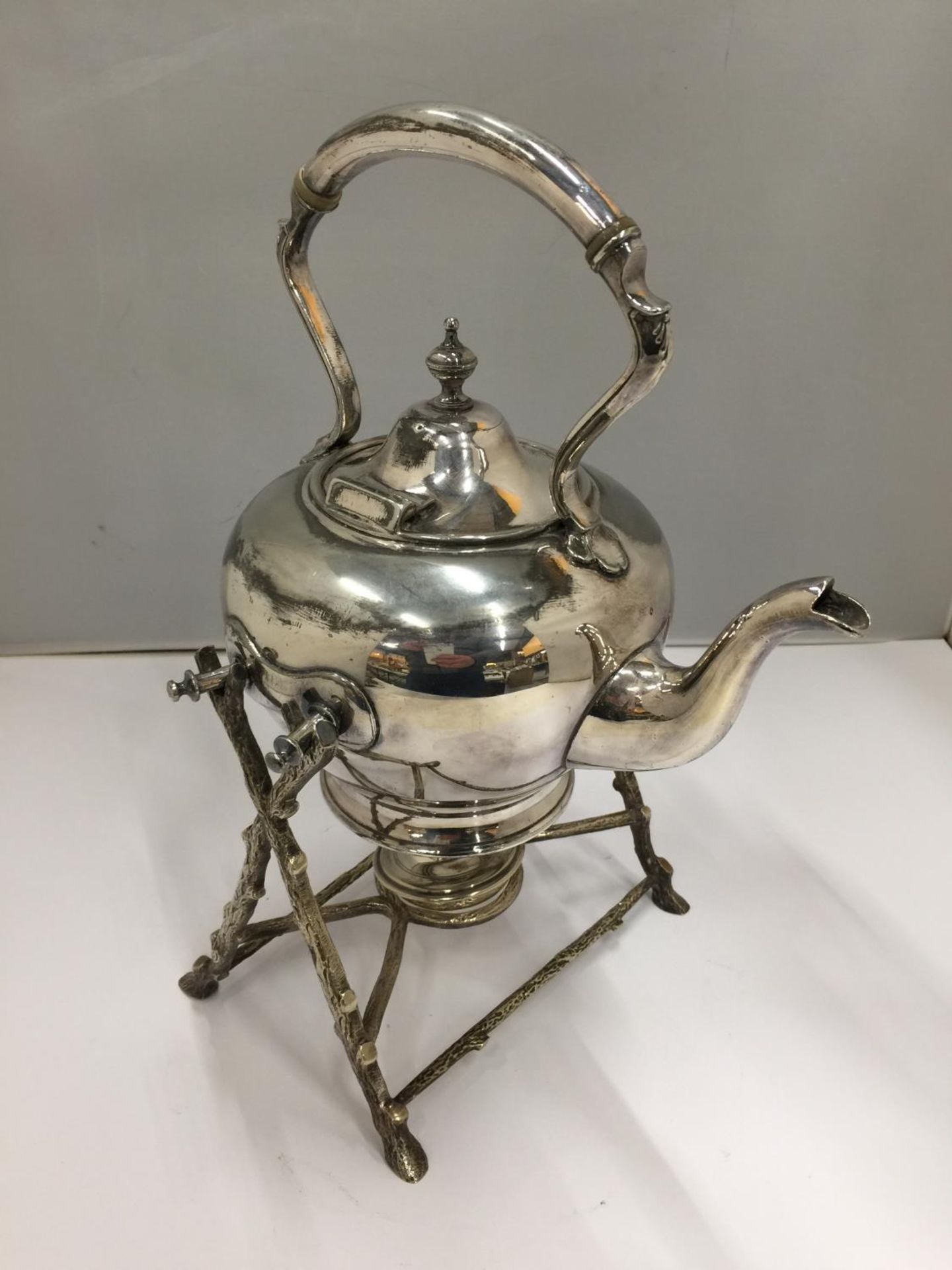 A SILVER PLATED KETTLE ON A STAND WITH SPIRIT BURNER