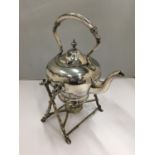 A SILVER PLATED KETTLE ON A STAND WITH SPIRIT BURNER