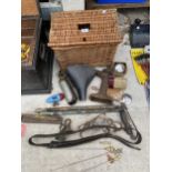 A WICKER BASKET AND AN ASSORTMENT OF VINTAGE TOOLS