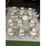 A QUANTITY OF CHINA CUPS, SAUCERS, PLATES, JUG, BOWL, ETC WITH A FLORAL PATTERN