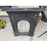 A DECORATIVE CAST IRON FIREPLACE