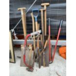 AN ASSORTMENT OF VINTAGE GARDEN TOOLS TO INCLUDE SHOVELS, AXES AND SHEARS ETC