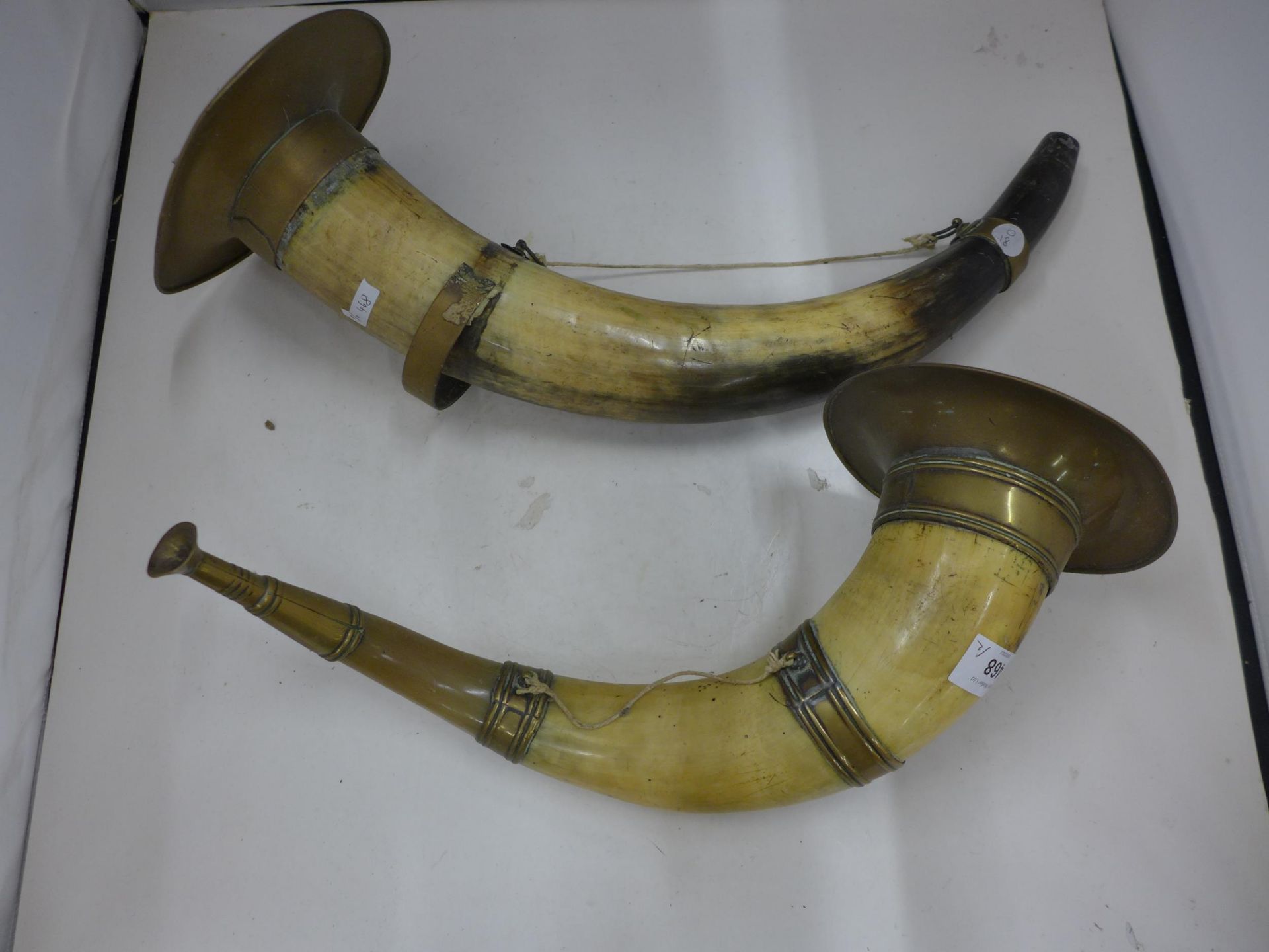 TWO LARGE VINTAGE BRASS MOUNTED HORN BUGLES, LENGTHS, 39CM AND 50CM (ONE A/F)