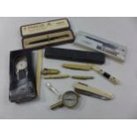 A COLLECTION OF ASSORTED PENKNIVES, CHEROOT HOLDER, PENS, COMPASS, PAIR OF CHILDS SHOES