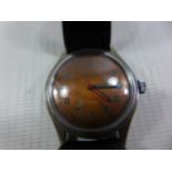 A MILUS MANS WRISTWATCH, DIAMETER OF FACE 2.5CM, WORKING WHEN CATALOGUED