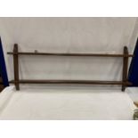 A MAHOGANY WALL HANGING PLATE RACK WITH TWO SHELVES