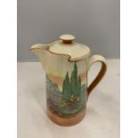 A DOULTON COFFEE POT WITH A LANDSCAPE DESIGN