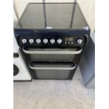 A BLACK ELECTRIC FREESTANDING OVEN AND HOB BELIEVED WORKING BUT NO WARRANTY
