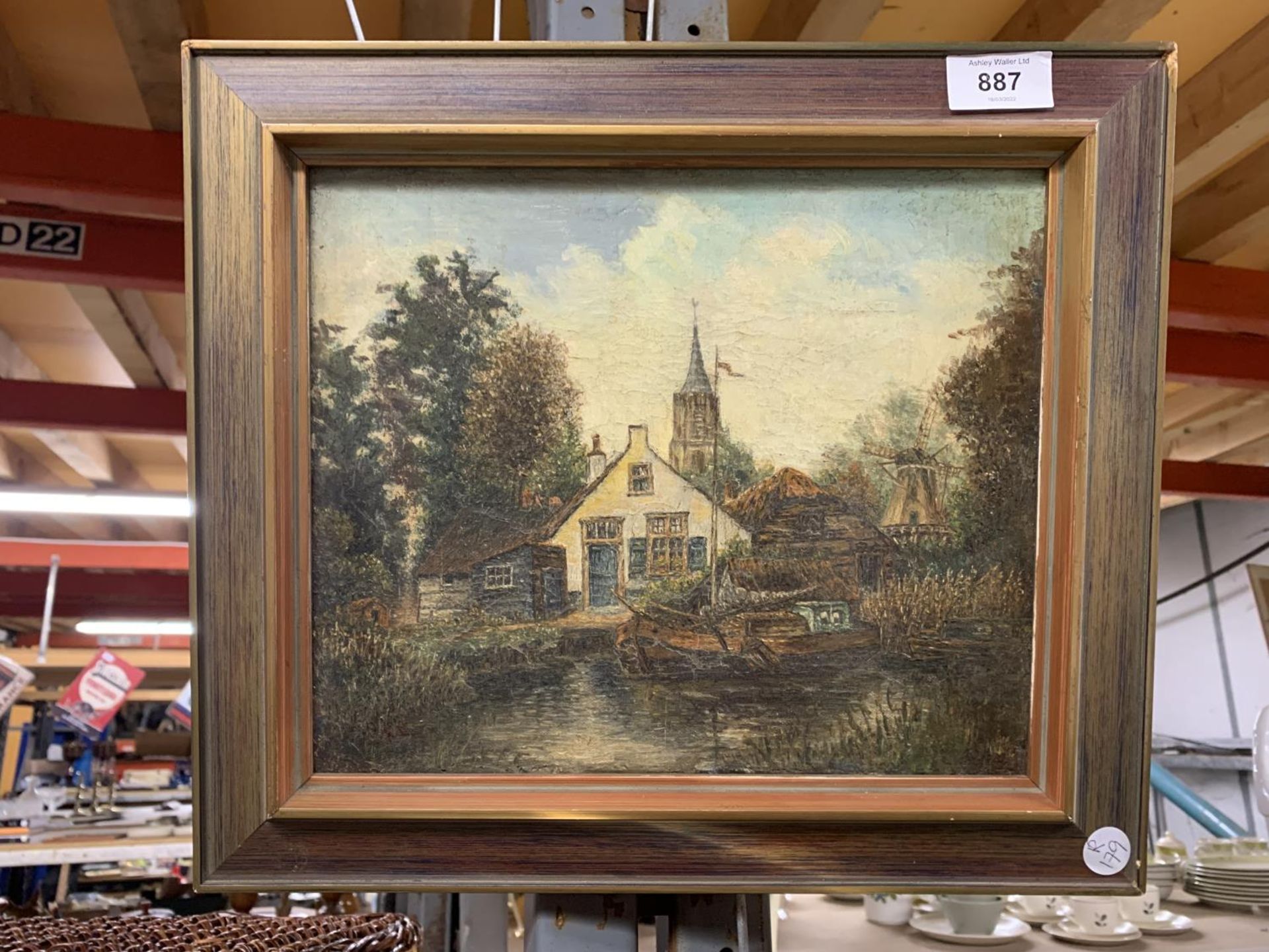 AN OLD OIL ON CANVAS PAINTING OF A DUTCH STYLE CANAL SCENE WITH BARGES AND A WINDMILL SIGNED HK