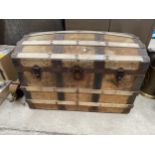 A VINTAGE WOODEN AND METAL BANDED STORAGE TRUNK